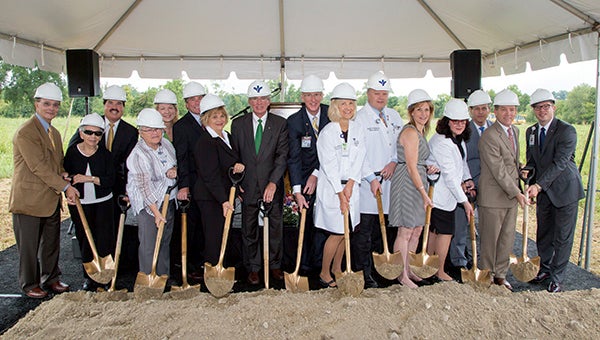 Officials from the city of Suffolk joined doctors and administrators from Bon Secours Virginia Health System to break ground on Thursday for a new cancer treatment center in Harbour View.