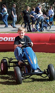 Greyson Davis, 8, enjoyed his day at the festival by taking part in some of the rides. He and Jen Davis, come most every year.