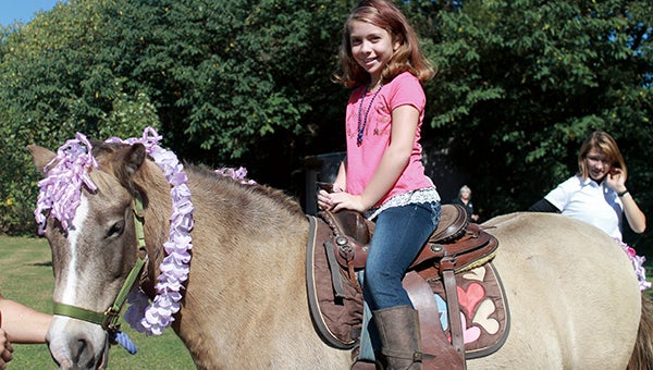 Rebekah Henley, 9, took part in the pony rides on Saturday afternoon. She and some of her relatives spent some quality time together at the family-friendly festival.