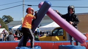 Nathaniel Spruill and Jayden Hilliard battle it out on one of the many fun inflatables.