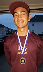 King’s Fork High School junior Tristen DeGuzman wears the medal he earned for being named the overall Top Performer at the 2015 Best of the 757 Baseball Camp and Showcase.