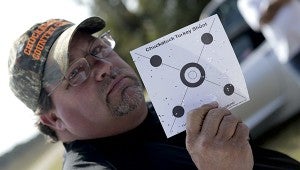 Bobby Broadhurst, bottom, shows off a winning target at a recent Chuckatuck Turkey Shoot.