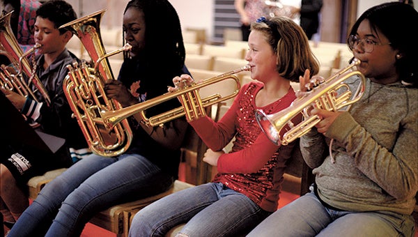 Music students play during a children's music ministry group at the Salvation Army each Thursday.