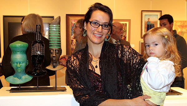 Robin Rogers and Julia Rogers, pictured with her daughter, Phoenix, were first-place winners in the Suffolk Art League’s annual juried exhibition, which is on display through Jan. 14.