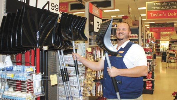 Matt Myers, assistant manager at Taylor’s Do It Center, is ready to sell snow shovels and ice removers.