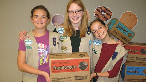 Suffolk residents and Girl Scout Cadettes, from left, Abigail Lockhart, Allison Maurice and Madison Kenyon, were among the nearly 1,000 Girl Scouts and their families who attended the Girl Scout Cookie kickoff on Nov. 21 at the Children’s Museum of Virginia. The cookie season officially starts Jan. 9. 