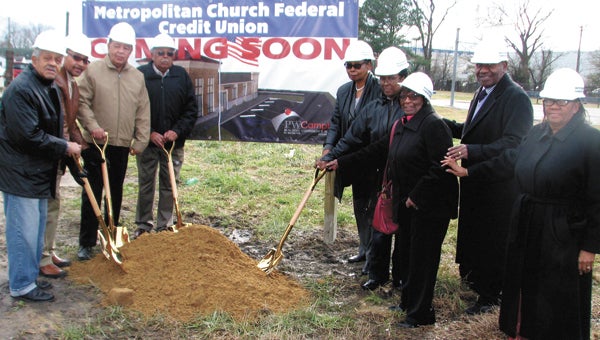 Board members, supervisory committee members and the manager of Metropolitan Church Federal Credit Union celebrate groundbreaking for the new location on Wednesday. Pictured from left are Calvin Holland, Lemuel Greene, John Kendale, Wilbur Bryant, Edna Goodman, Eleanor Minns, Bertha Wigfall, Ronald Hart and Barbara Thompson.