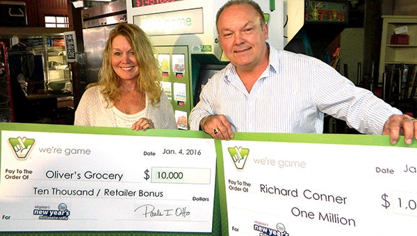 Brenda and Ricky Conner, owner of Oliver’s Grocery, show off their Virginia Lottery winnings on Monday: a $1 million jackpot, plus an additional $10,000 bonus to the store for selling the winning ticket. Conner bought 103 of 174 New Year’s Millionaire Raffle tickets sold at the Holland Road store.
