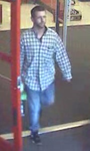 Police are seeking this man they say used a credit card belonging to a purse-snatching victim.