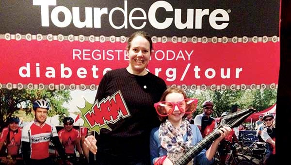 Maggie Morris Fears and her daughter, Caitlin, ham it up at a Tour de Cure event. The two will ride together for the American Diabetes Association fundraiser on April 30. 