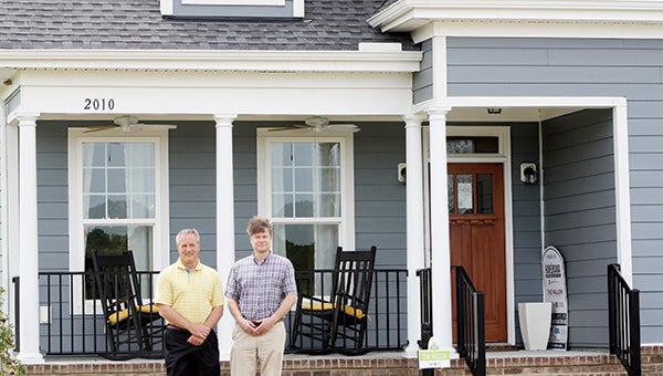 Chip Wirth and Tim Riley, of Wirth Development Corp., stand in front of a model home at Summer Creek Estates. 