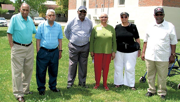 Several graduates of Booker T. Washington High School and Councilman Curtis Milteer, second from left, stand near the spot where a marker will be placed this year to commemorate the school’s history. From left are George Richards, class of 1940; Milteer; Ron Hart, class of 1960; Julia Bradley, class of 1956; and Hattie and Willie Lyons, class of 1959.
