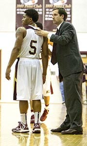 Josh Worrell’s ability to reach and motivate young people, like Rod Parrett, left, is what has long made him a successful coach, helping the King’s Fork High School Bulldogs go 203-70 over the last 10 years.