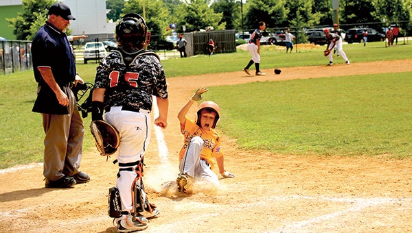 Jason Cooney slides home to score the winning run during the Bennett’s Creek All Stars game versus Churchland. (Submitted Photo)