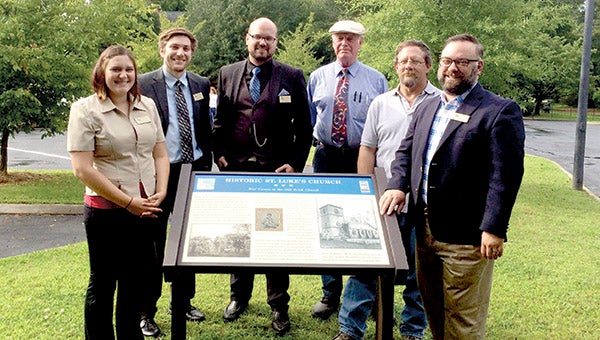 From left, Rachel Popp, education coordinator; Joseph Tapia, marketing coordinator; Collin Norman, assistant director; Albert Burckard, secretary of Isle of Wight historical society; Chris Stevans, president and captain of Virginia 3rd Infantry living historical organization; and Todd Ballance, executive director of St. Luke’s Church in Smithfield, were all part of a celebration marking the unveiling of a new historical marker there on Tuesday.