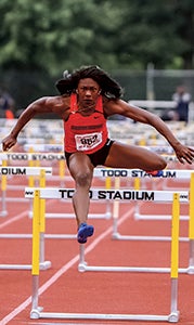 Brandeé Johnson hurdles at the 5A state track and field championship. Johnson received the Duke Automotive-Suffolk News-Herald Player of the Year award for the third time. (MARY ANN MAGNANT PHOTO)