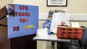 Pizza, drinks, cards and a poster are among the items donated to the Suffolk Police First Precinct.