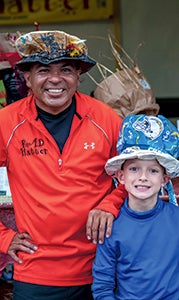 Tony Melendez, also known as the “Rad Hatter,” and Connor Frantzich show off Connor’s new hat creation.