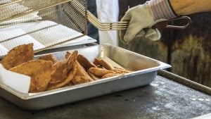 Battered and fried fish awaits the plates of eager fish fry visitors at the Chuckatuck Volunteer Fire Department's semi-annual event.