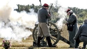 The Knibbs Battery gives a cannon salute during the dedication of a headstone for a Confederate soldier in Skeetertown Cemetery on Saturday.