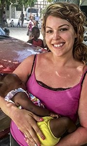Jackie Enlow holds a child in Montrouis, Haiti, where she serves as a missionary. Enlow will be the featured speaker at a women’s conference Jan. 15 at Liberty Spring Christian Church.